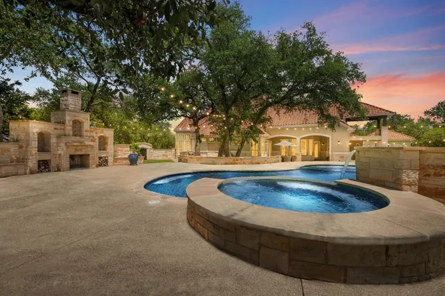 a view of outdoor space with swimming pool and trees