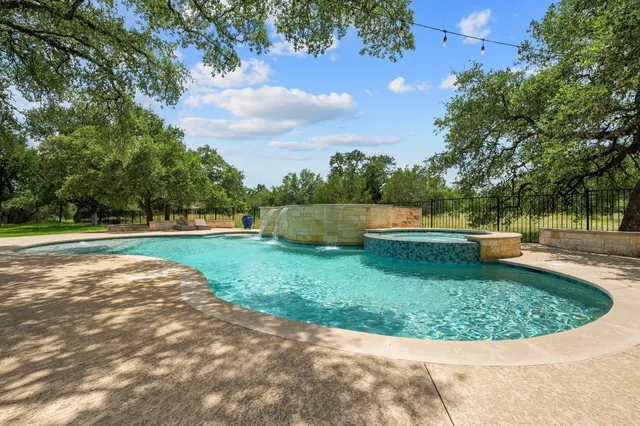 a view of a swimming pool with a patio