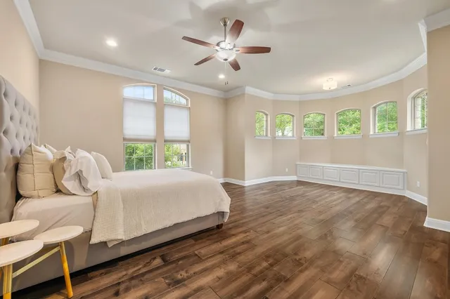 a bathroom with a granite countertop sink toilet and mirror