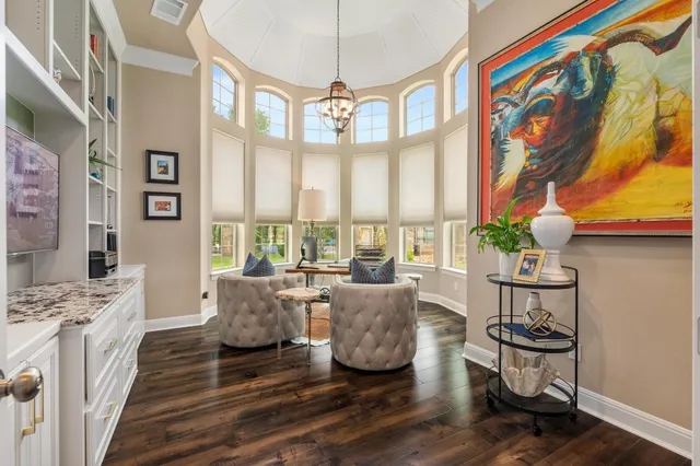 a living room with furniture a fireplace and decor