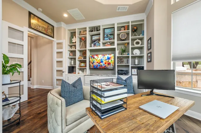 a living room with furniture and a floor to ceiling window