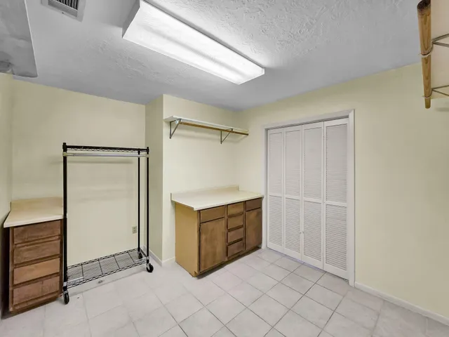 a view of a kitchen with a microwave and a stove top oven