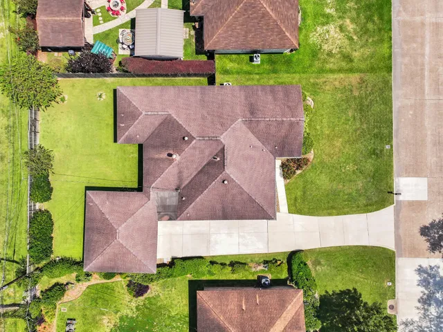 an aerial view of a house with a garden