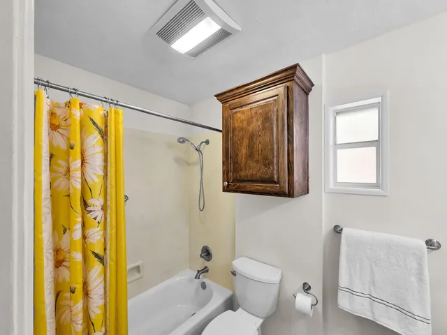a bathroom with a toilet a sink and a bathtub