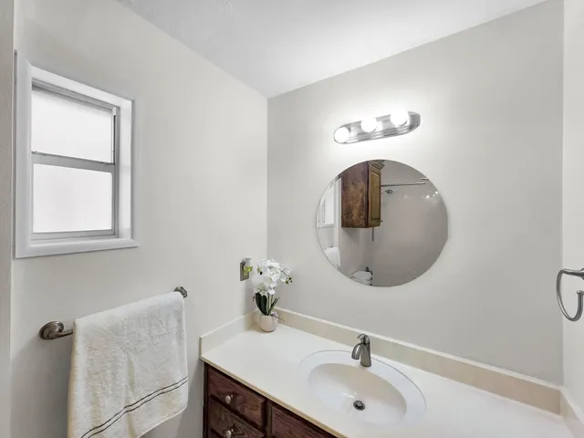 a bathroom with a sink and a mirror