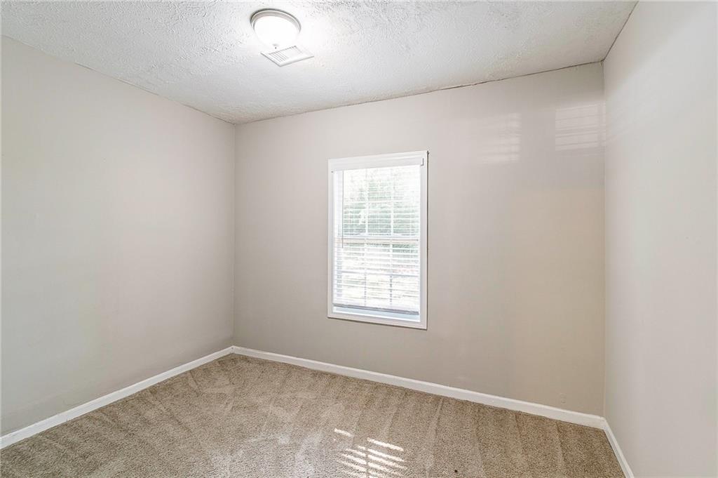 1669 Freedom Valley Decatur, GA 30032 - Photo 11 of 27 an empty room with windows