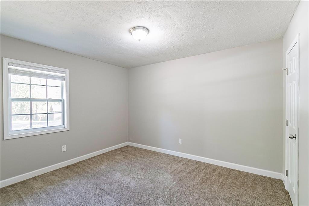 1669 Freedom Valley Decatur, GA 30032 - Photo 15 of 27 an empty room with a window
