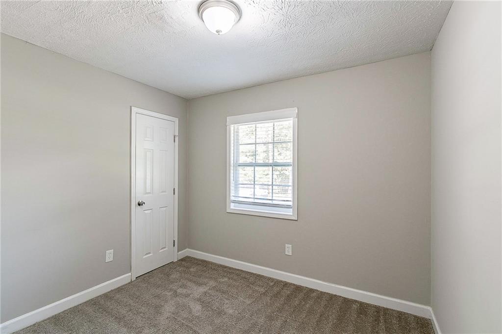 1669 Freedom Valley Decatur, GA 30032 - Photo 17 of 27 an empty room with windows