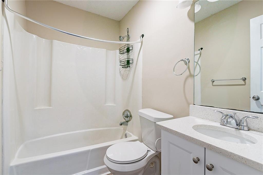 1669 Freedom Valley Decatur, GA 30032 - Photo 19 of 27 a bathroom with a sink a toilet and a bathtub