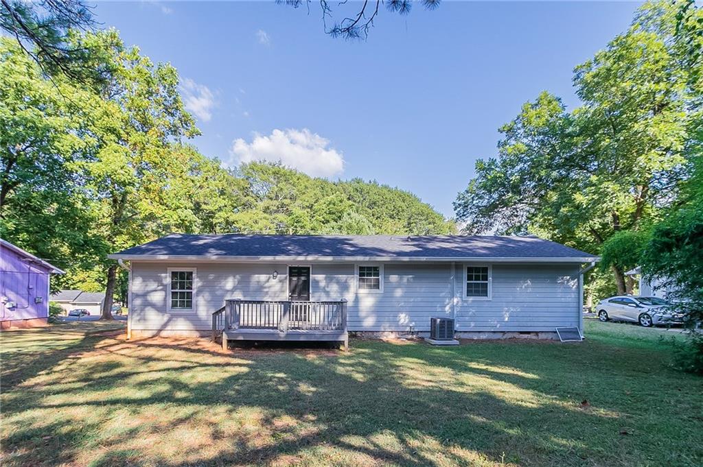 1669 Freedom Valley Decatur, GA 30032 - Photo 22 of 27 a front view of house with yard and green space