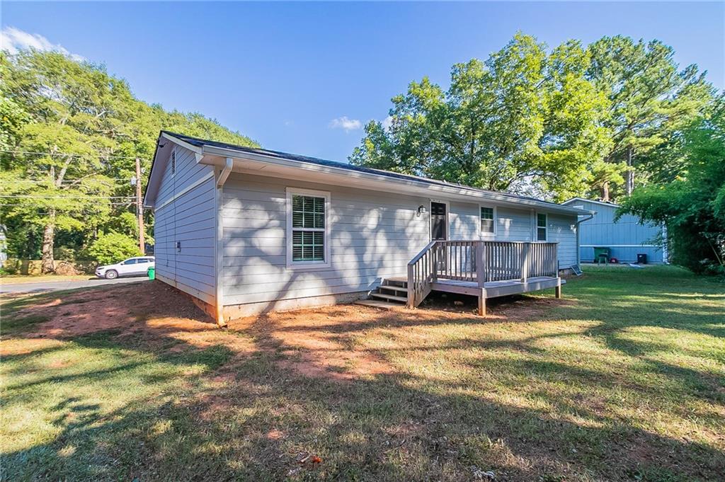 1669 Freedom Valley Decatur, GA 30032 - Photo 23 of 27 a view of a house with a patio and a yard