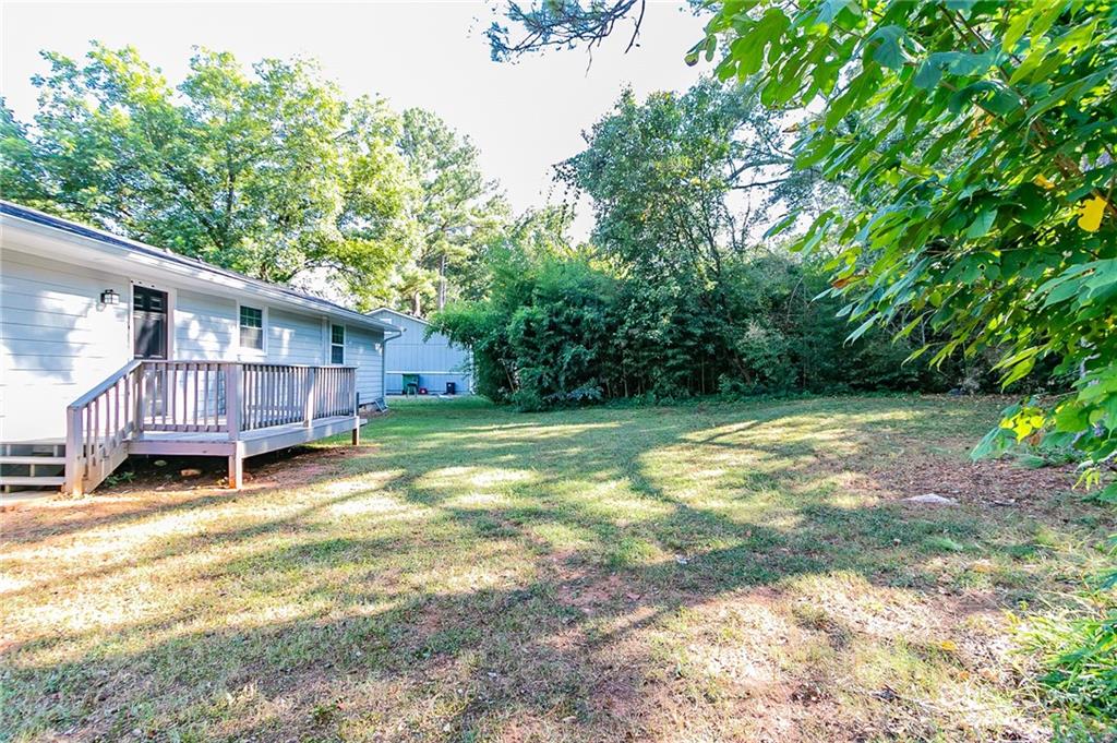 1669 Freedom Valley Decatur, GA 30032 - Photo 24 of 27 a view of a house with backyard and sitting area