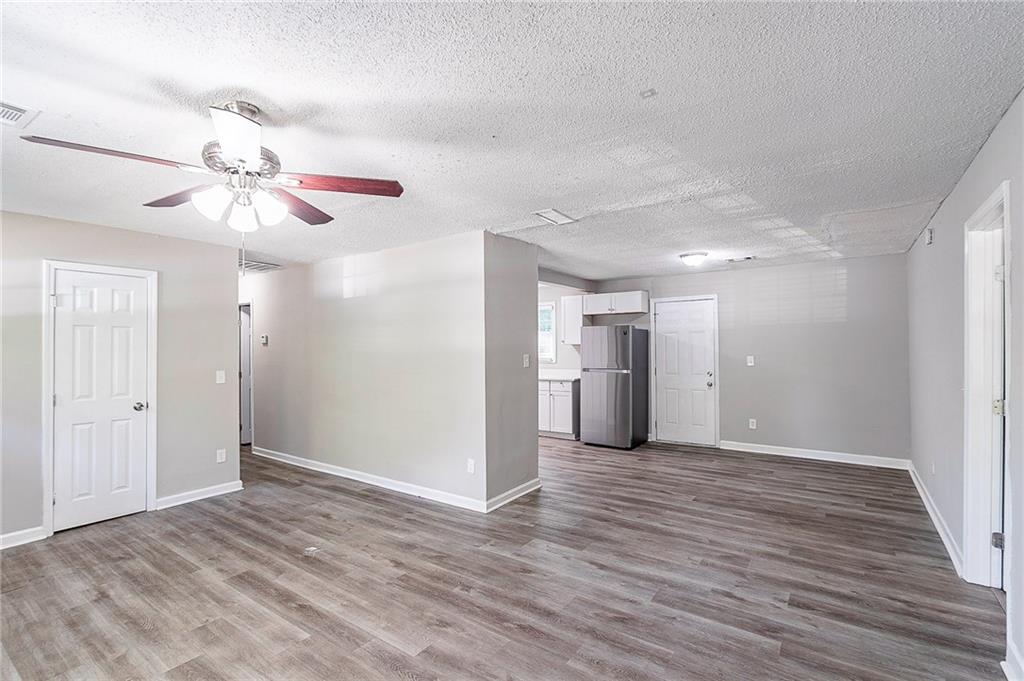 1669 Freedom Valley Decatur, GA 30032 - Photo 5 of 27 a view of a room with wooden floor and a ceiling fan