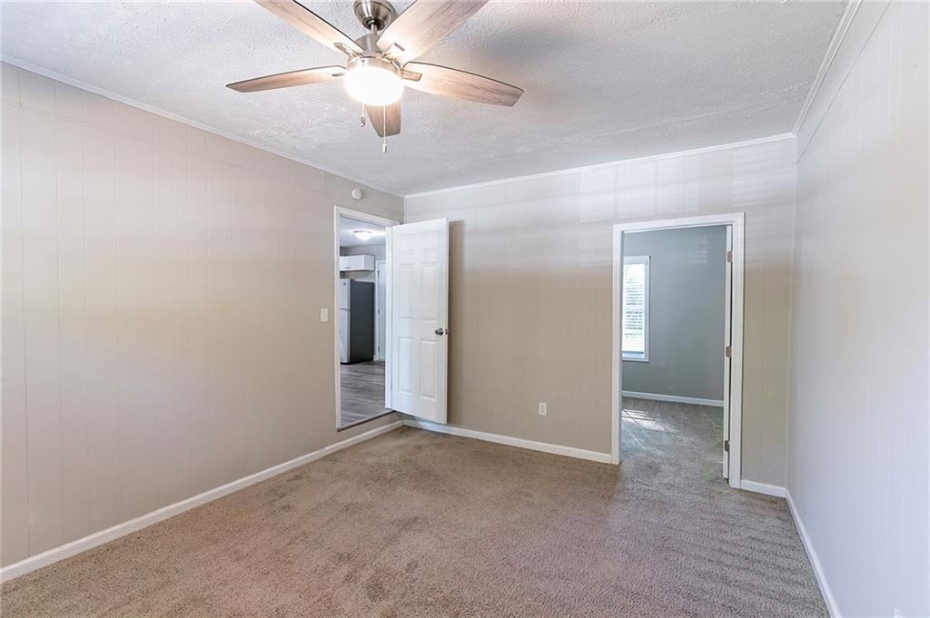 1669 Freedom Valley Decatur, GA 30032 - Photo 10 of 27 an empty room with closet and a ceiling fan