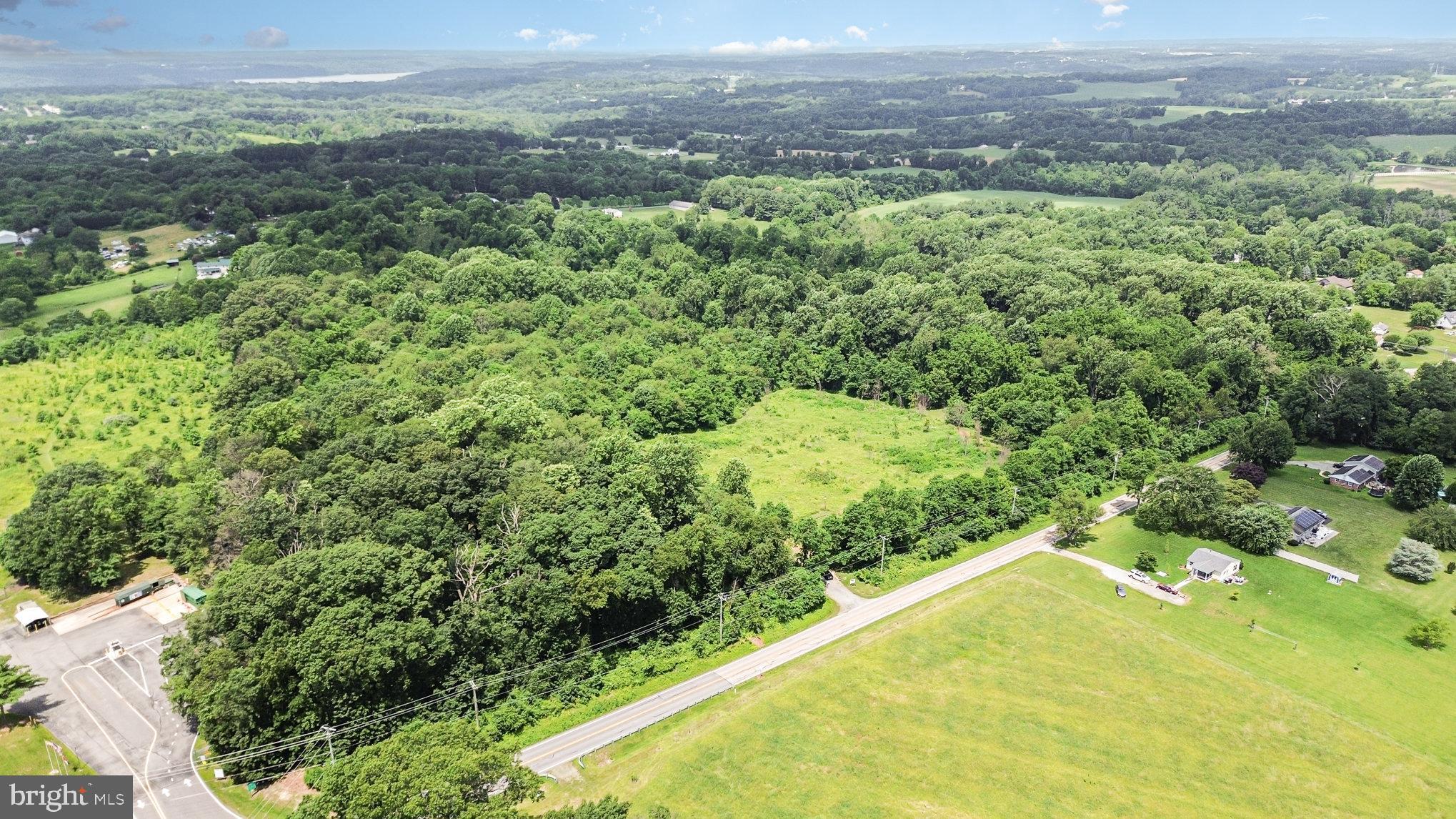 Colora Road Port Deposit, MD 21904 - Photo 7 of 19 a view of a field with a forest