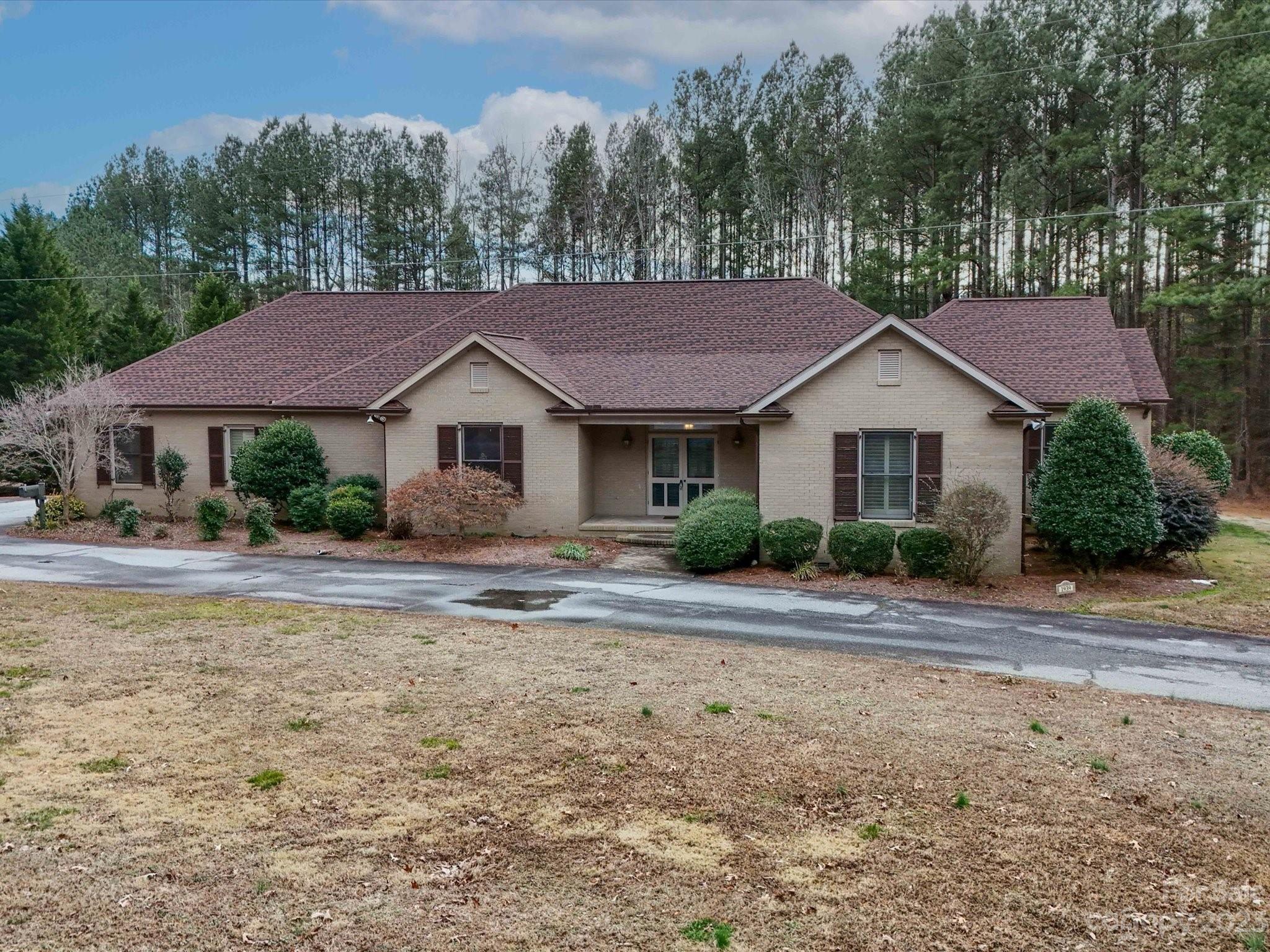 1939 Neel Road Salisbury, NC 28147 - Photo 1 of 48 a house that has a lot of plants in it