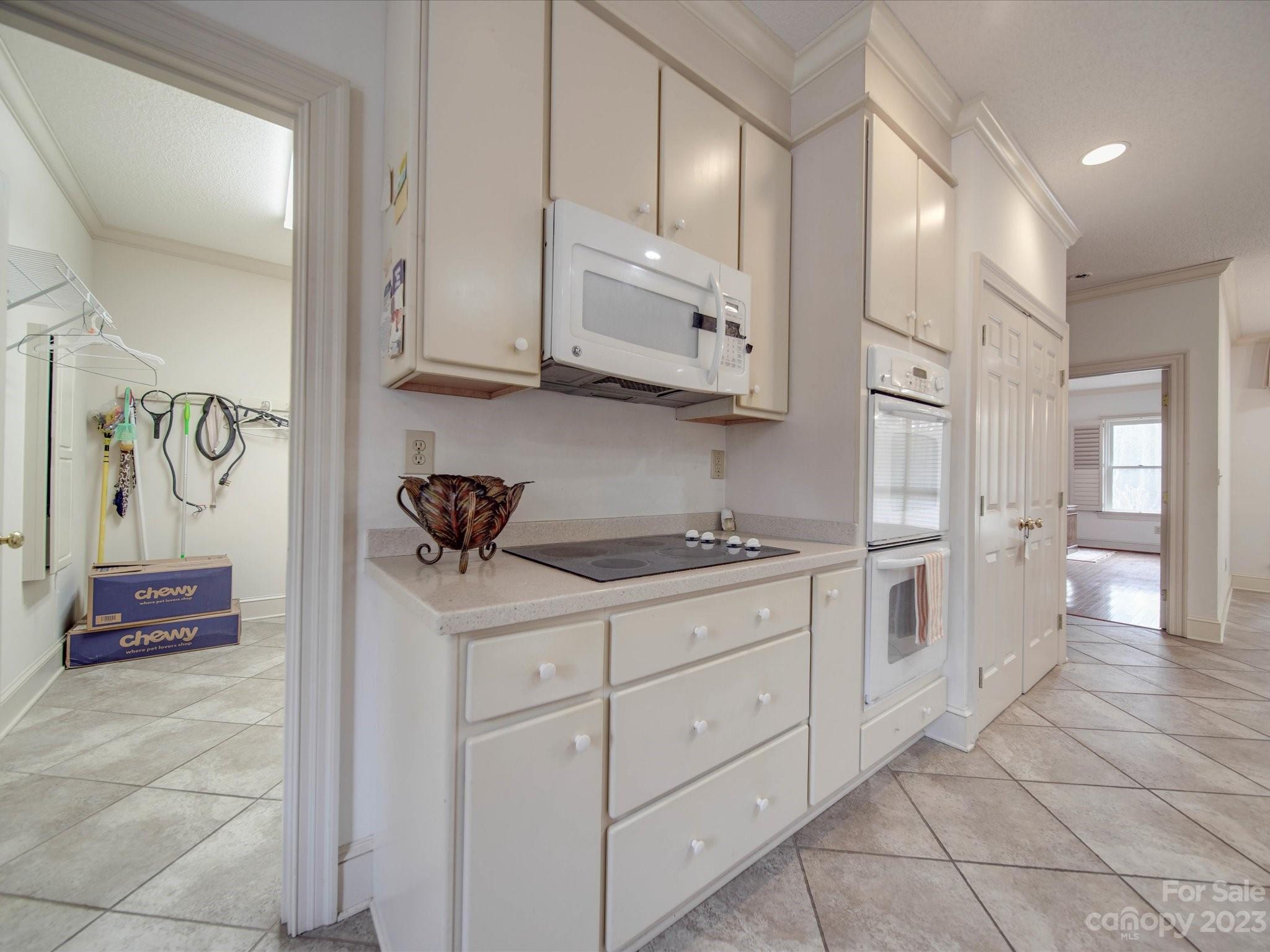1939 Neel Road Salisbury, NC 28147 - Photo 13 of 48 a kitchen with stainless steel appliances granite countertop a sink and cabinets