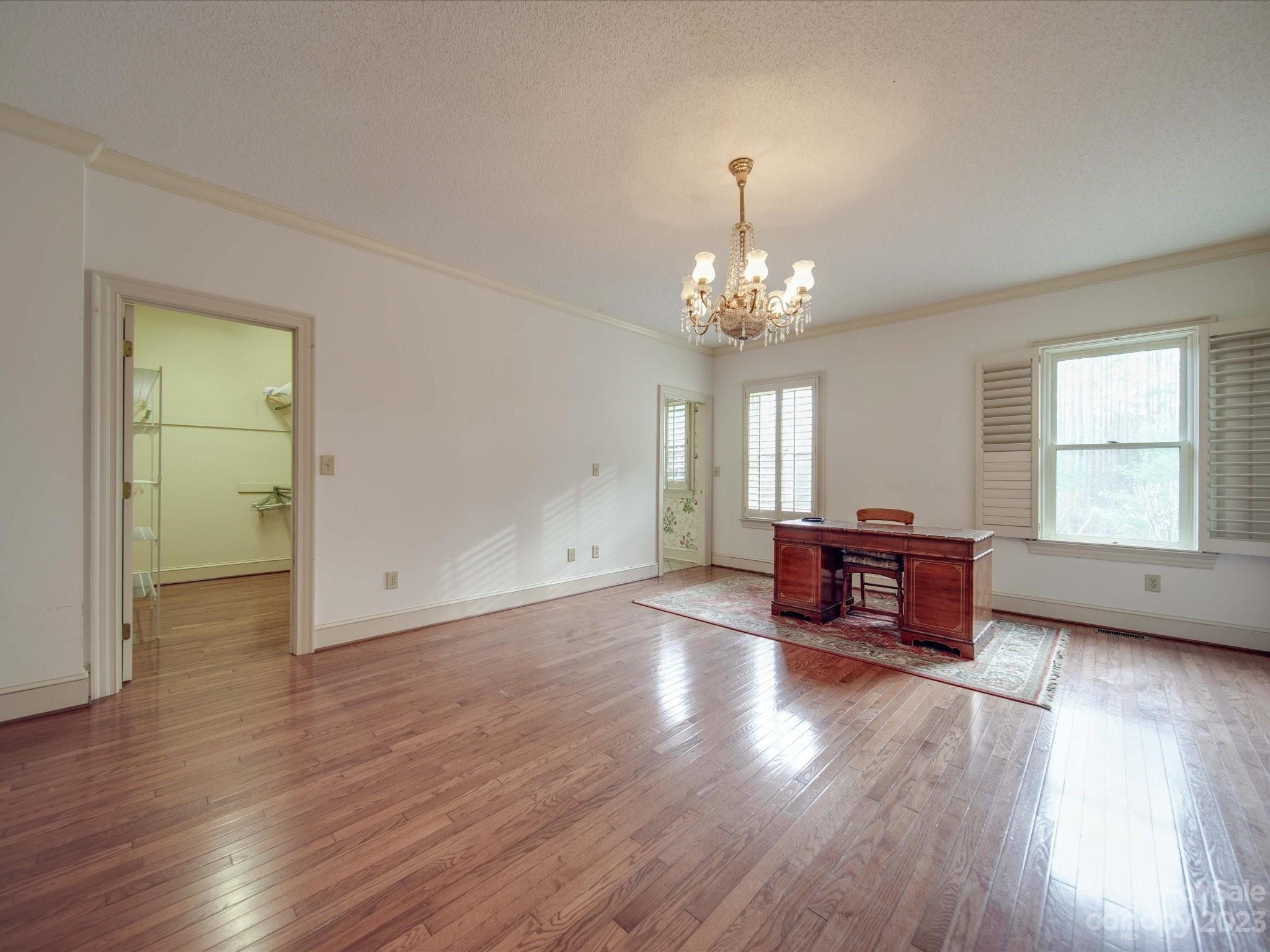 1939 Neel Road Salisbury, NC 28147 - Photo 21 of 48 a living room with furniture and a chandelier