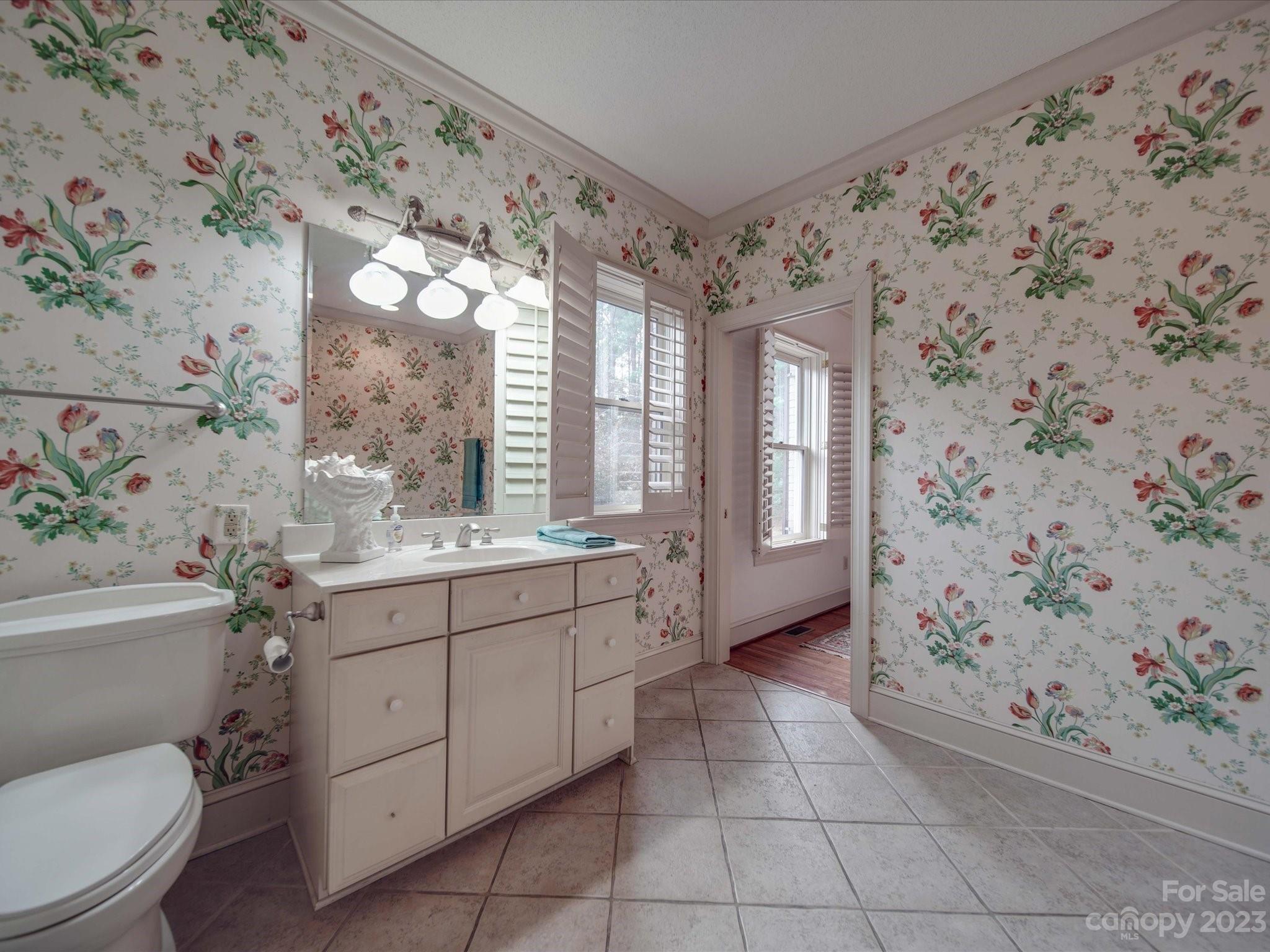 1939 Neel Road Salisbury, NC 28147 - Photo 27 of 48 a bathroom with a toilet sink and mirror