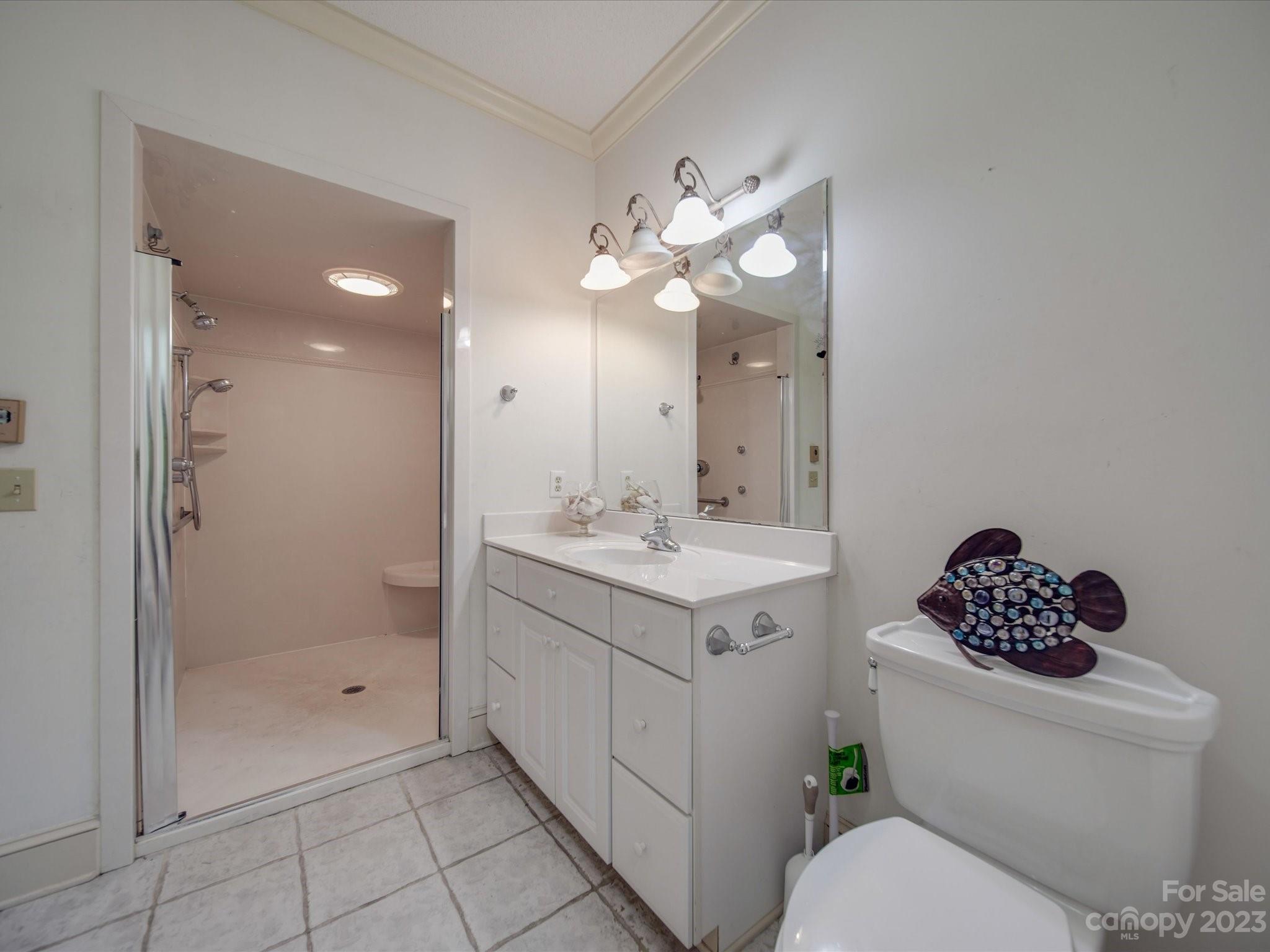 1939 Neel Road Salisbury, NC 28147 - Photo 31 of 48 a bathroom with a sink a toilet and shower