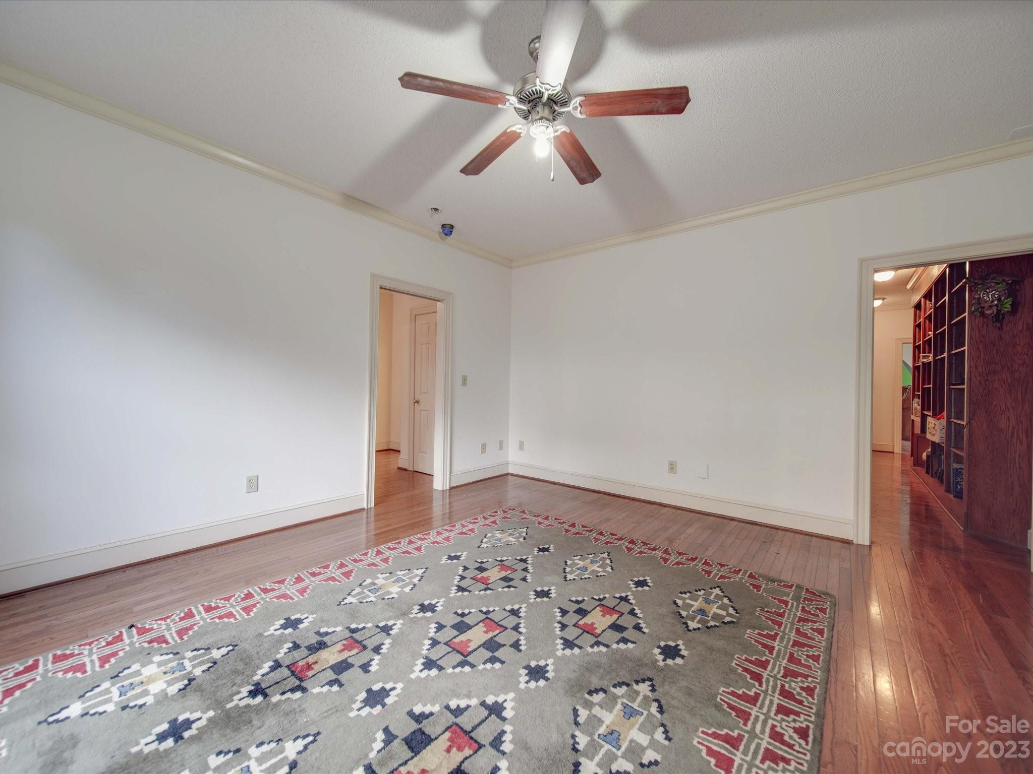 1939 Neel Road Salisbury, NC 28147 - Photo 35 of 48 a view of a big room with wooden floor and chandelier fan