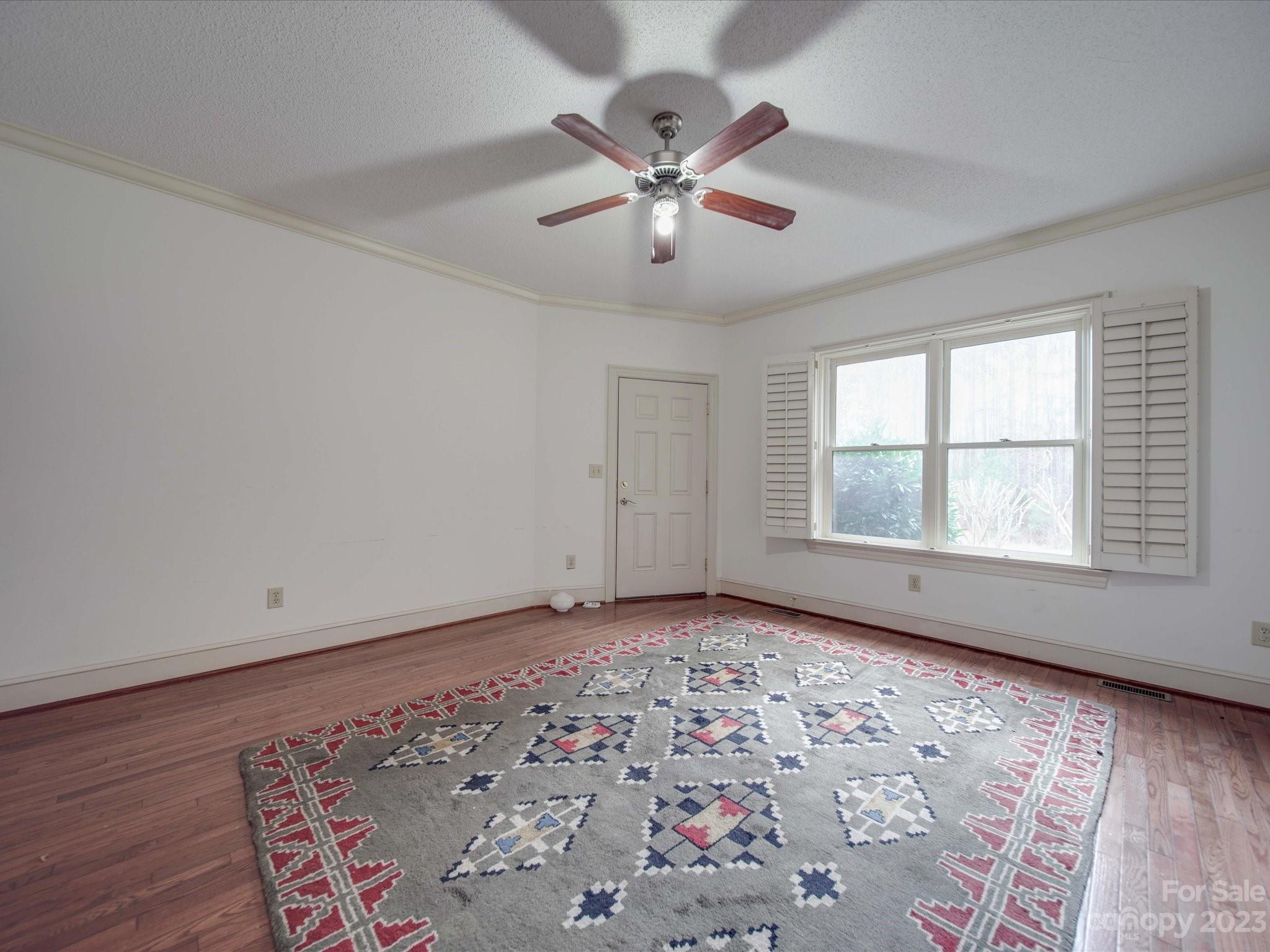 1939 Neel Road Salisbury, NC 28147 - Photo 36 of 48 an empty room with window and ceiling fan