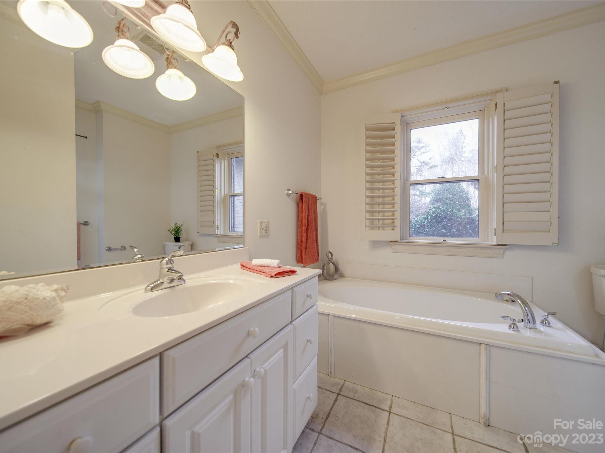 1939 Neel Road Salisbury, NC 28147 - Photo 37 of 48 a bathroom with a sink and a bathtub