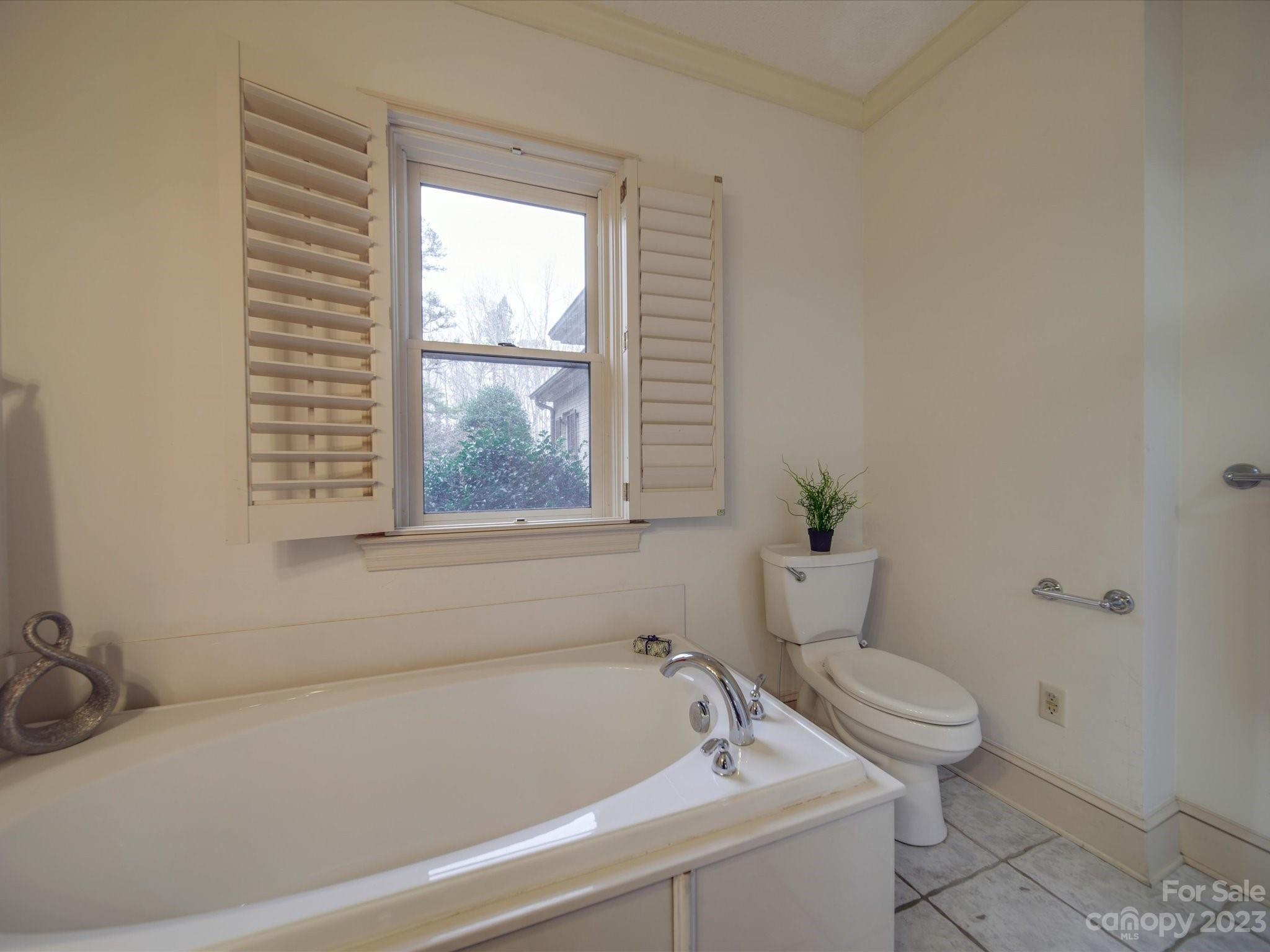 1939 Neel Road Salisbury, NC 28147 - Photo 39 of 48 a white bath tub sitting next to a toilet