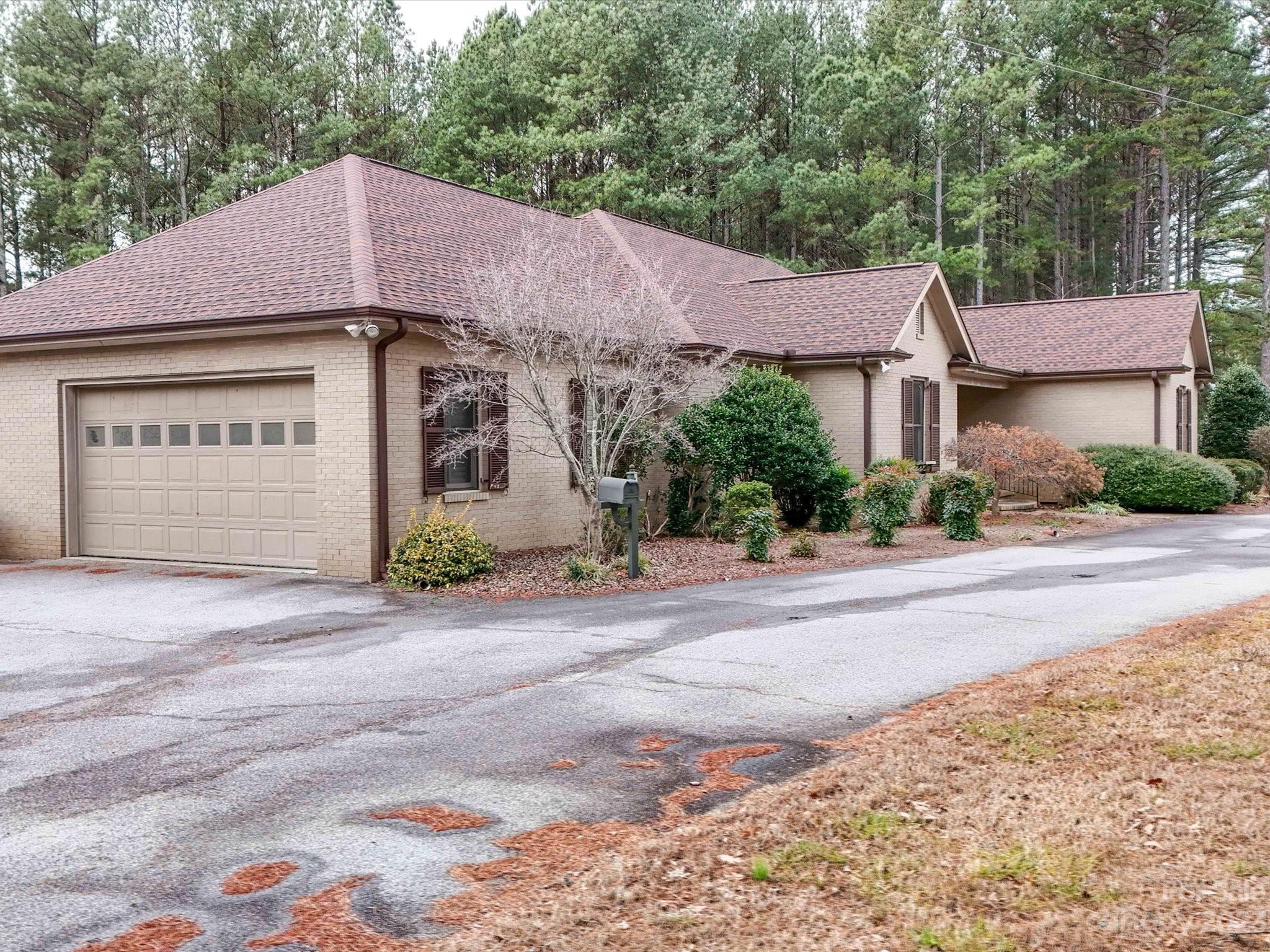 1939 Neel Road Salisbury, NC 28147 - Photo 45 of 48 a front view of a house with a yard and garage