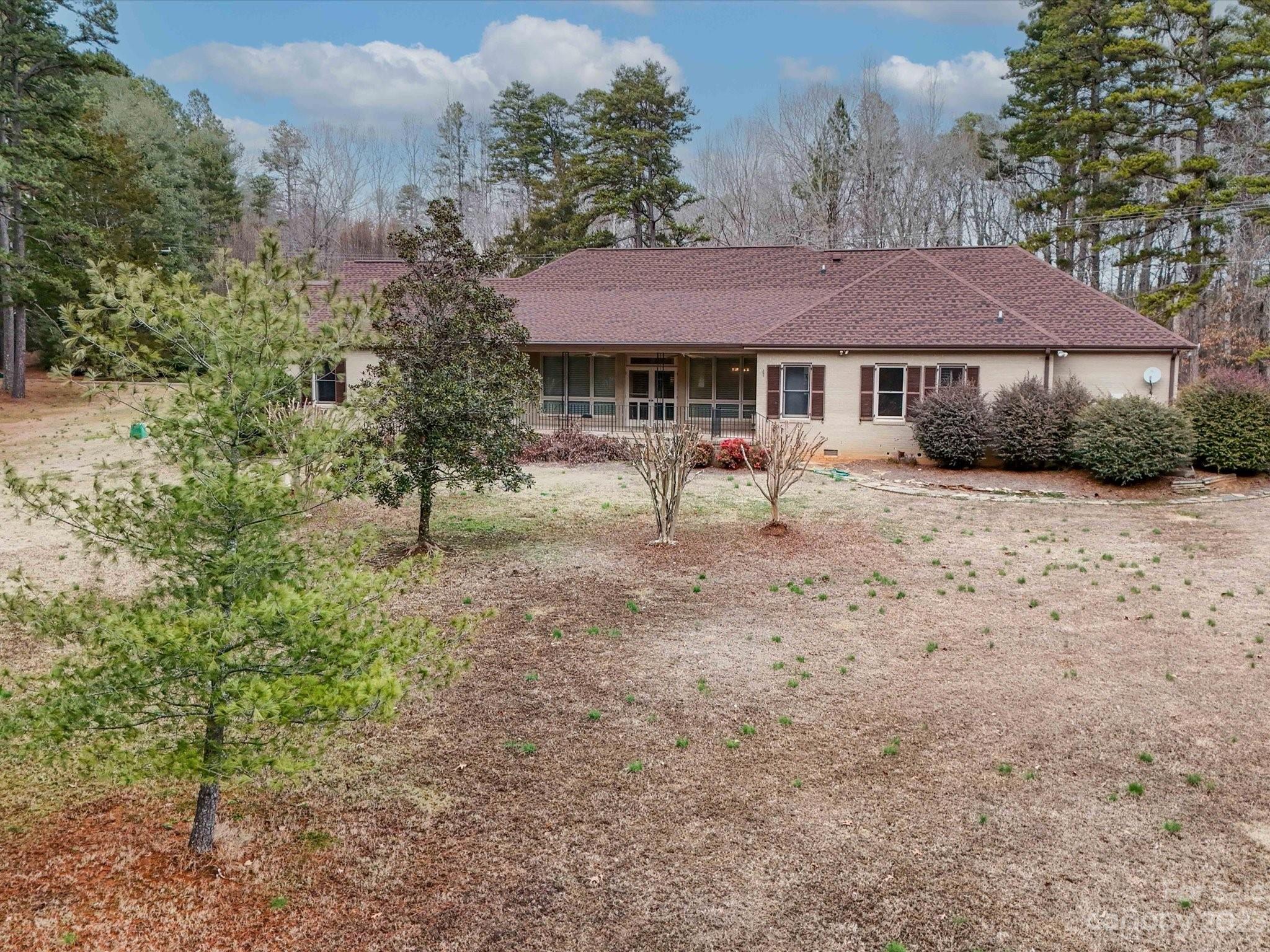 1939 Neel Road Salisbury, NC 28147 - Photo 46 of 48 a view of a house with a yard