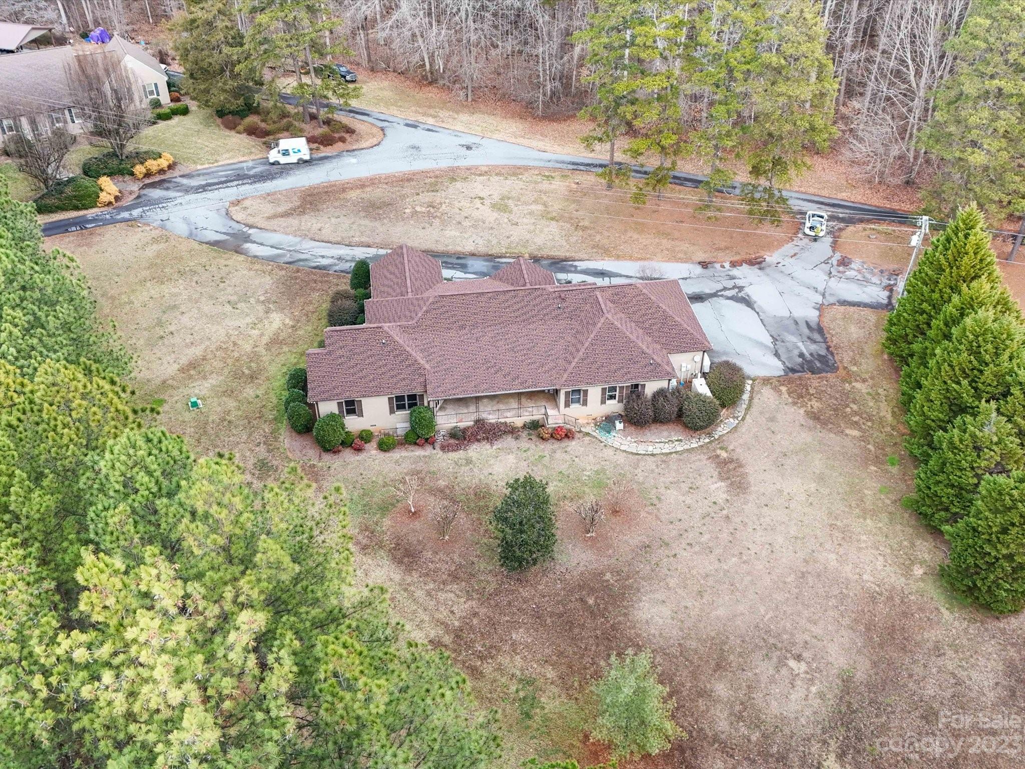 1939 Neel Road Salisbury, NC 28147 - Photo 8 of 48 an aerial view of a house with yard and parking