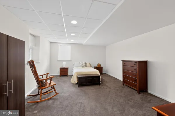 a bedroom with a bed and a table