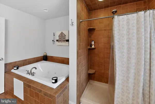 a spacious bathroom with a sink and a mirror