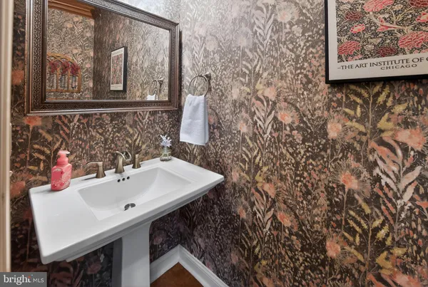 a bathroom with a sink double vanity and a toilet
