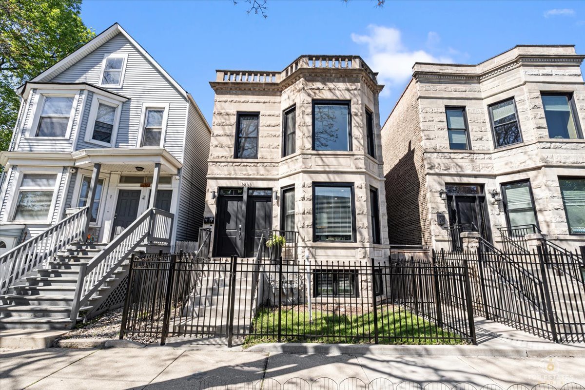 3432 West Belden Avenue, Unit G Chicago, IL 60647 - Photo 1 of 32 a front view of a house