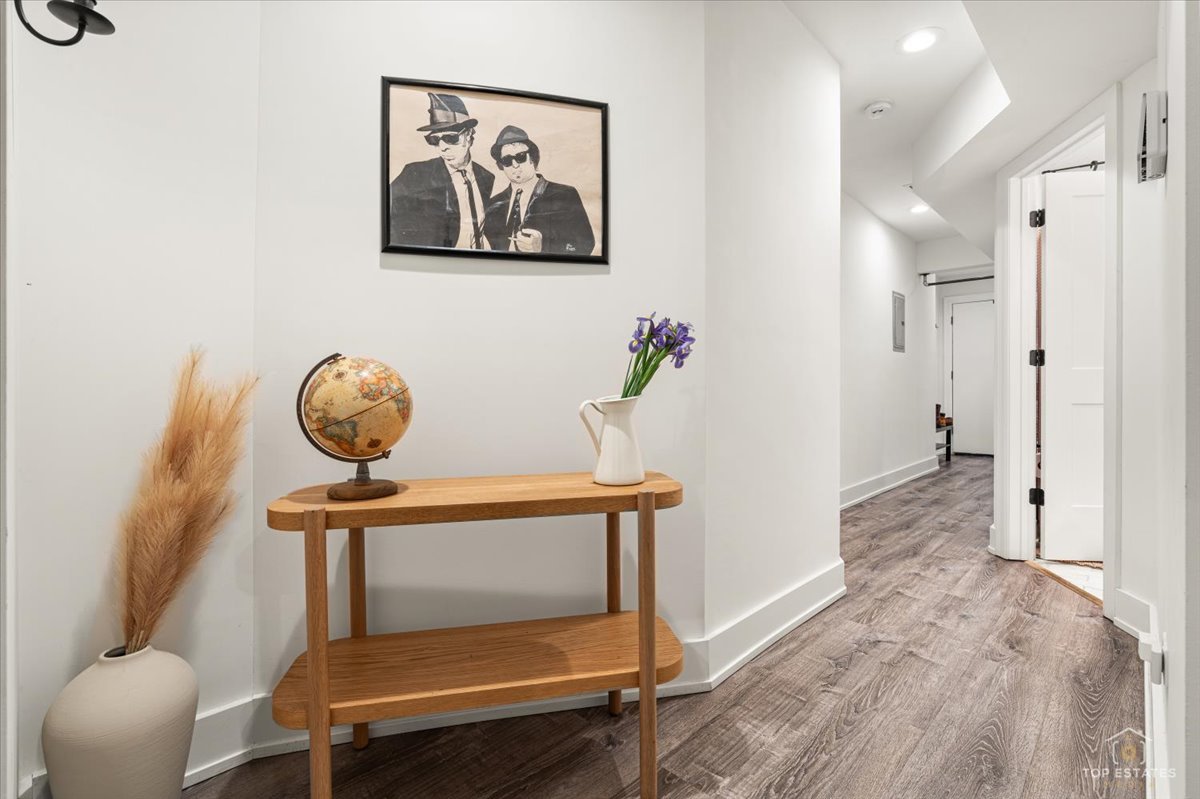 3432 West Belden Avenue, Unit G Chicago, IL 60647 - Photo 17 of 32 a view of room with furniture and wooden floor