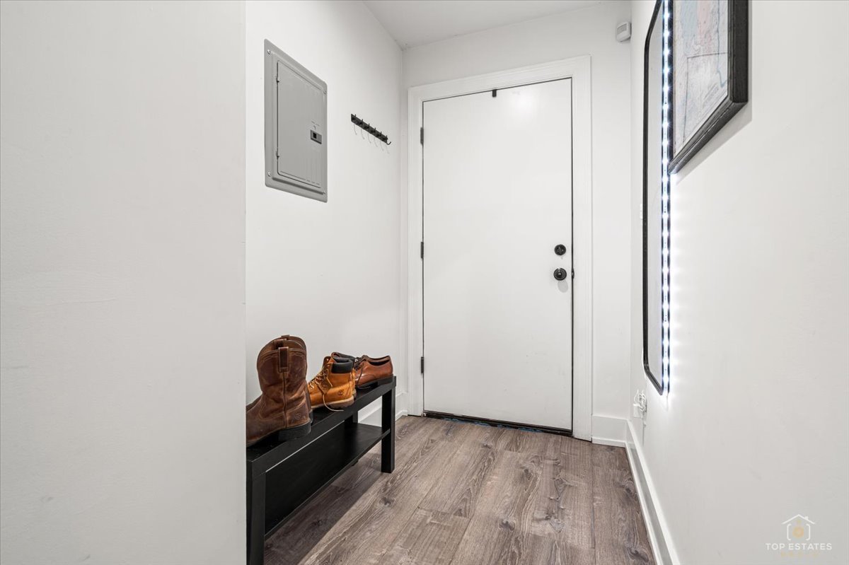 3432 West Belden Avenue, Unit G Chicago, IL 60647 - Photo 19 of 32 a view of a hallway to a livingroom with furniture