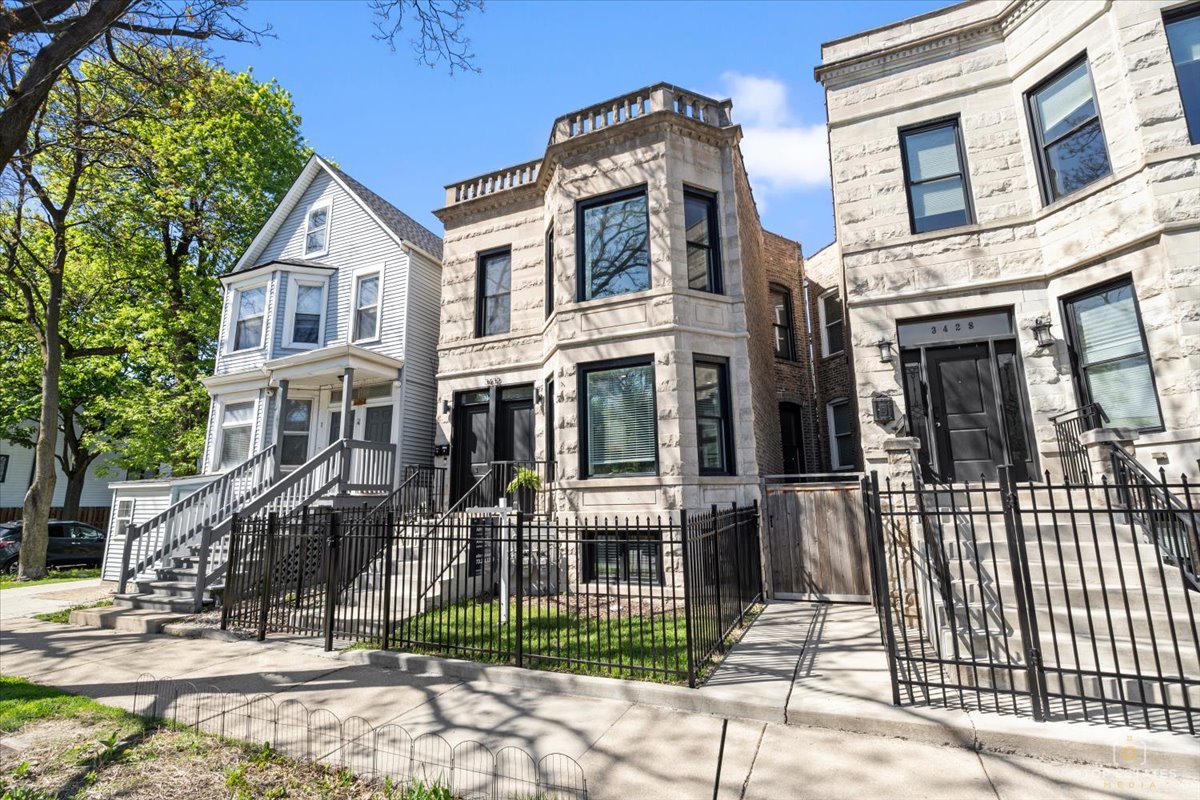 3432 West Belden Avenue, Unit G Chicago, IL 60647 - Photo 2 of 32 a front view of a house