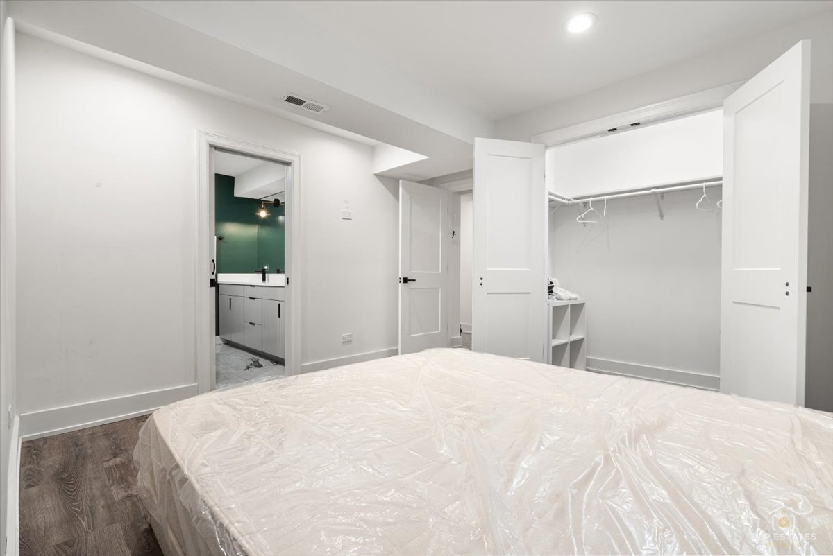 3432 West Belden Avenue, Unit G Chicago, IL 60647 - Photo 22 of 32 a large white bed in a white room