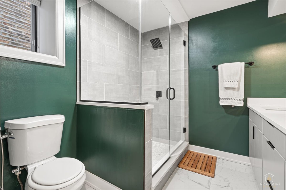 3432 West Belden Avenue, Unit G Chicago, IL 60647 - Photo 24 of 32 a bathroom with a toilet and a shower