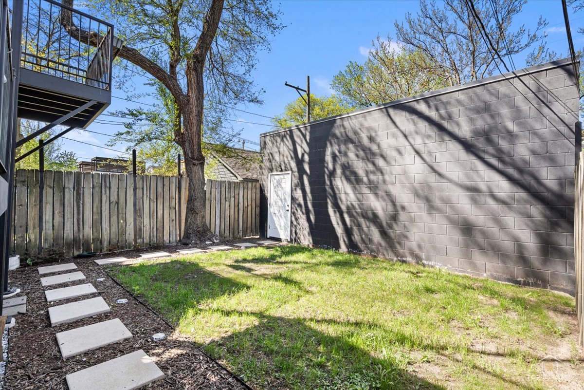 3432 West Belden Avenue, Unit G Chicago, IL 60647 - Photo 31 of 32 a view of a backyard with a tree