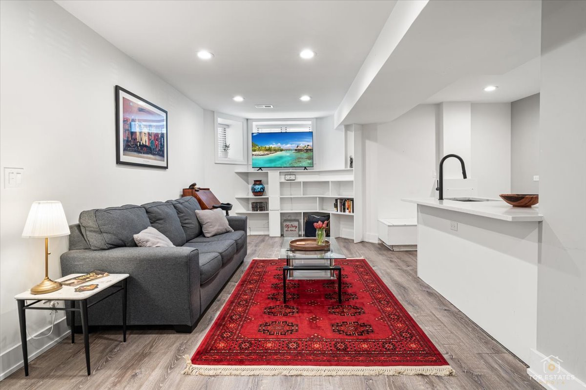 3432 West Belden Avenue, Unit G Chicago, IL 60647 - Photo 8 of 32 a living room with furniture and a rug