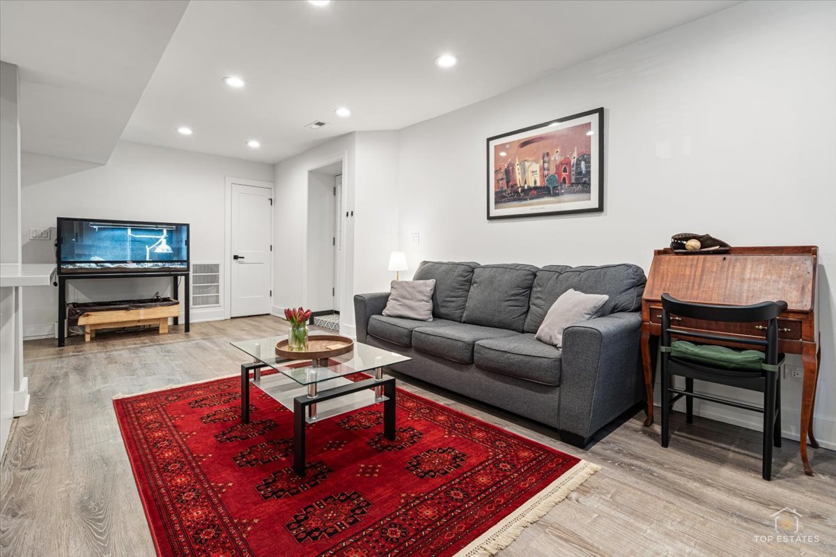 3432 West Belden Avenue, Unit G Chicago, IL 60647 - Photo 9 of 32 a living room with furniture and a flat screen tv