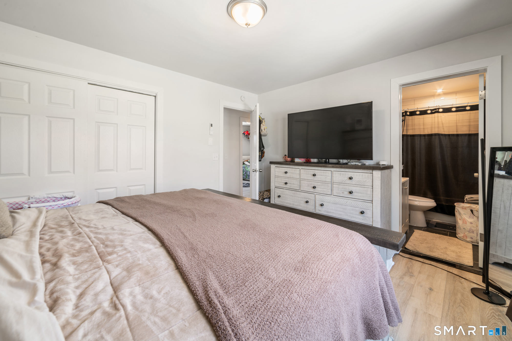 327 Lakeside Boulevard West Waterbury, CT 06708 - Photo 11 of 29 a bedroom with a bed and a flat screen tv