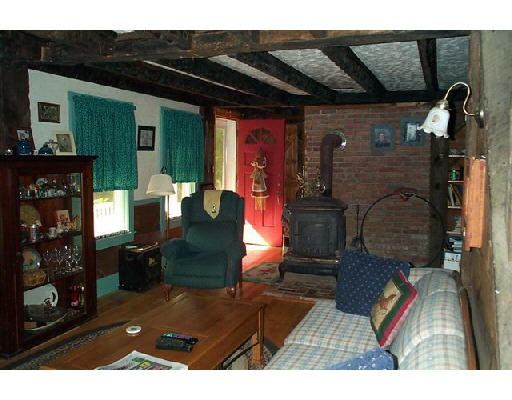 29 North Sullivan Road Charlton, MA 01507 - Photo 6 of 6 a living room with furniture and a fireplace