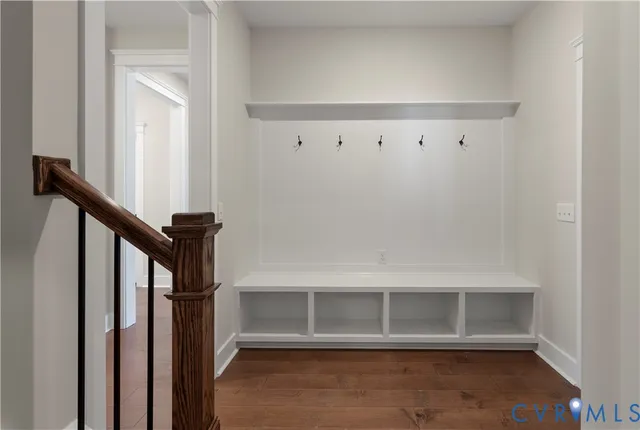 a view of staircase with white walls and a window