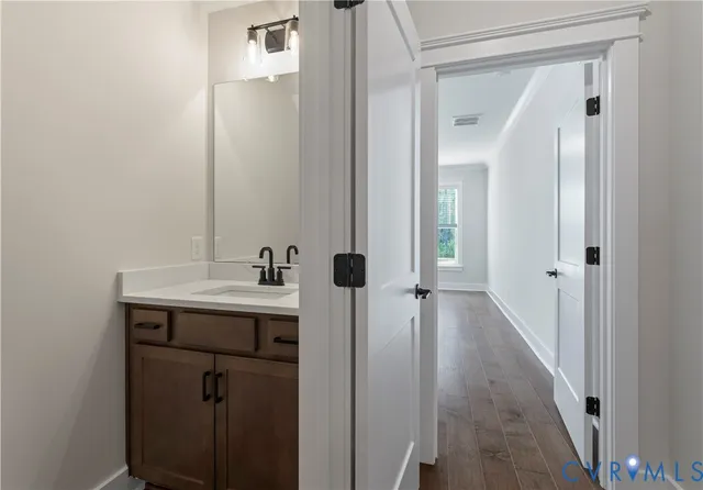 a view of a bathroom from a hallway
