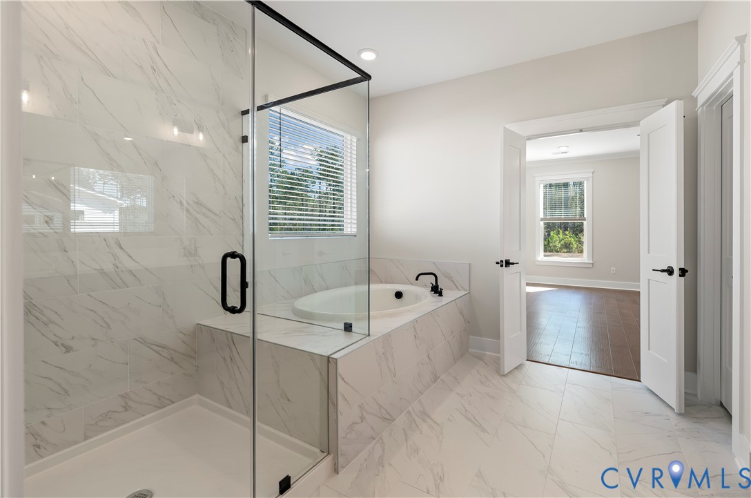 3708 Rocketts Rdg Drive Goochland, VA 23063 - Photo 17 of 29 a bathroom with a tub a potted plant and a shower