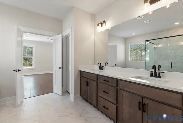 a bathroom with a double vanity sink mirror and double