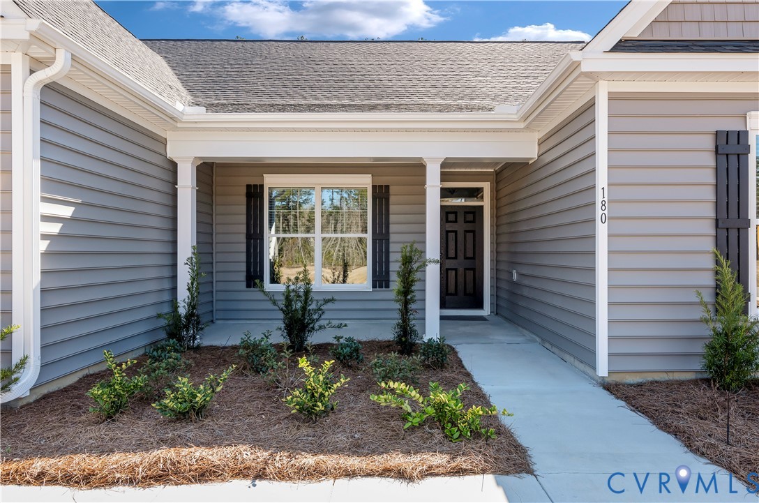 3708 Rocketts Rdg Drive Goochland, VA 23063 - Photo 2 of 29 a front view of a house with garden